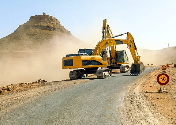 Two excavators working on the road N09 betwen Jbel Bani and Zagora.