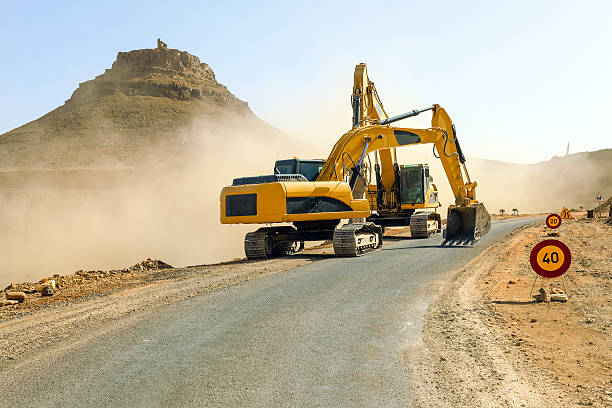 Two excavators working on the road N09 betwen Jbel Bani and Zagora.